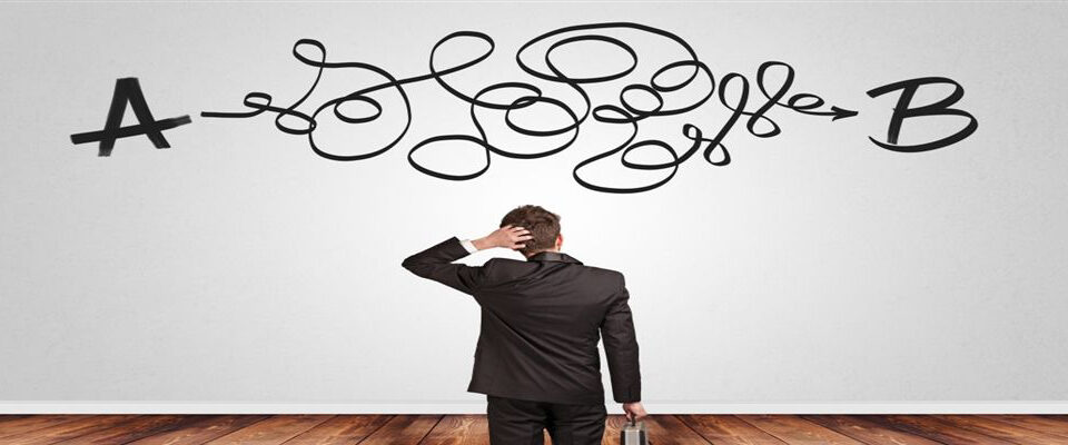 Man scratching head and thinking deciding - Hosted VoIP Phone Systems